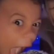 A Kid Screams Into The Microphone Violently