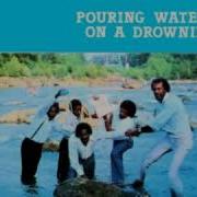 Larry Davis Pouring Water On A Drowning Man