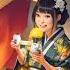 Beautiful Young Japanese Woman In Kimono Drinking