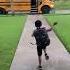 Little Boy Falls Onto Grass While Running To Catch School Bus