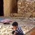 Sepideh And His Children Bringing Stones And Repairing The Front Of The Hut