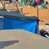 Single Mother And Her Daughters Trying To Cement The Kitchen Roof With Severe Arm Pain