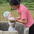 17 Year Old Single Mother Takes Care Of Vegetable Garden And Digs Worms To Feed Ducklings