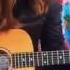 Tini Playing Guitar