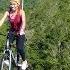 Tourists Ride Bicycle Over Zipline