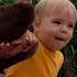 Baby Teaches His Dog How To Feed The Duckies