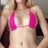 Hot Blonde Wearing A Pink Micro Bikini Shows Her Sexy Body Cleavage