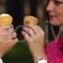 Couple In Love Eating Ice Cream And Kissing In The Park