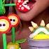 ASMR EDIBLE SUPER MARIO PARTY FIRE FLOWER CAKE POP EDIBLE BOWSER PIRANHA PLANT MUKBANG